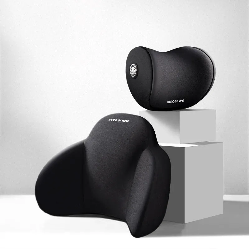 Black memory foam triangle lumbar support pillow and headrest on a car seat.