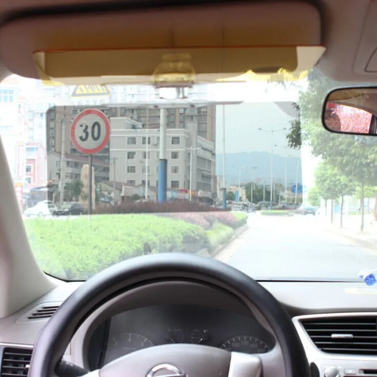 Car day and night dual-use glare proof mirror in PVC material on a sun visor