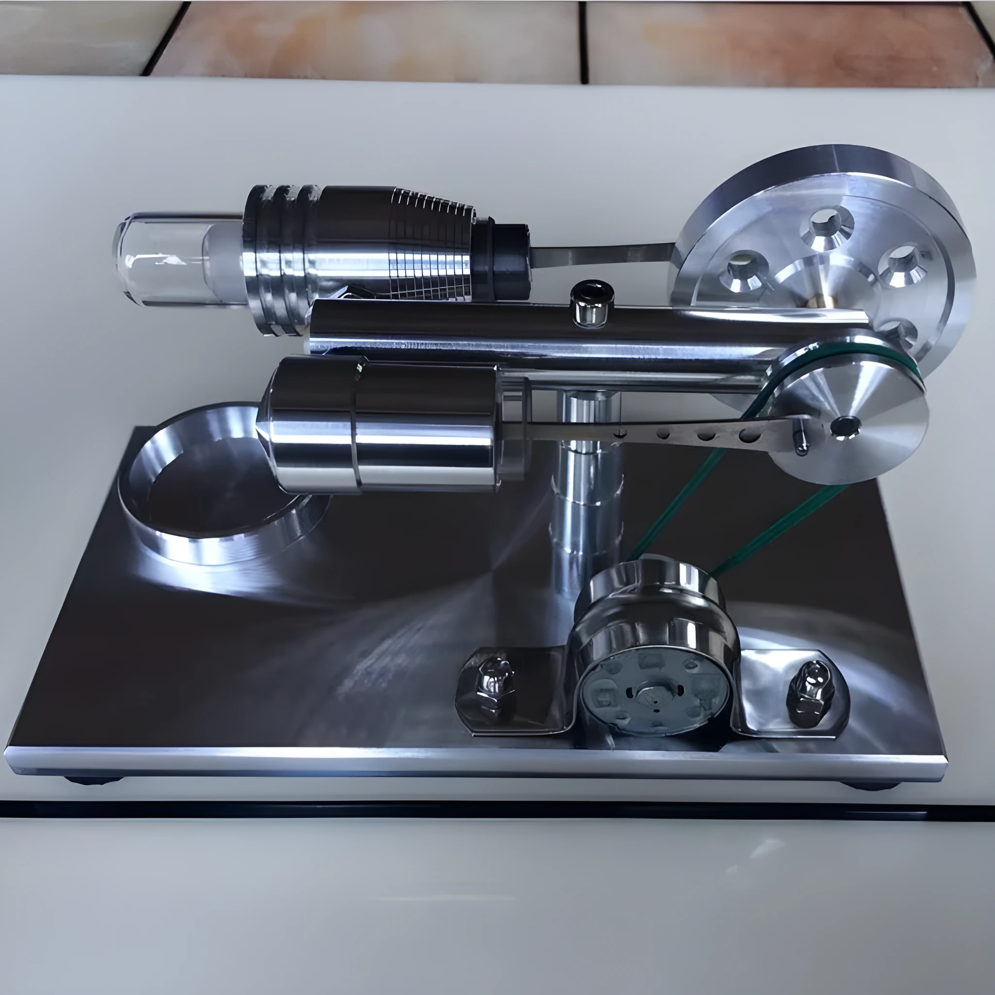 2019 Red upgrade miniature Stirling engine toy on a desk, 155x80x85mm, showing flywheel and cylinder