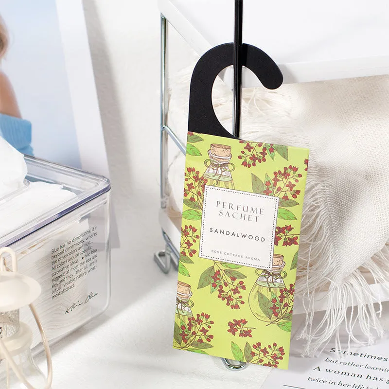 Pack of five household wardrobe sachets with lavender, rose, jasmine, sandalwood, vanilla, apricot blossom aromas on a shelf