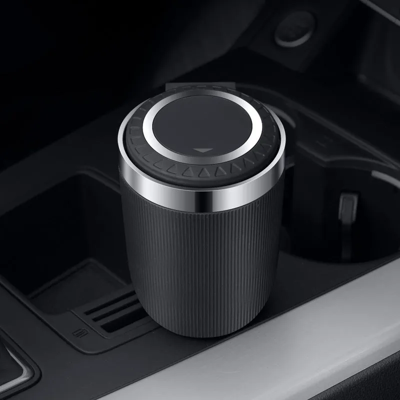 Metal ABS car ashtray with cover and blue LED light against a dark background