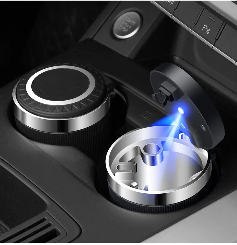 Metal ABS car ashtray with cover and blue LED light against a dark background