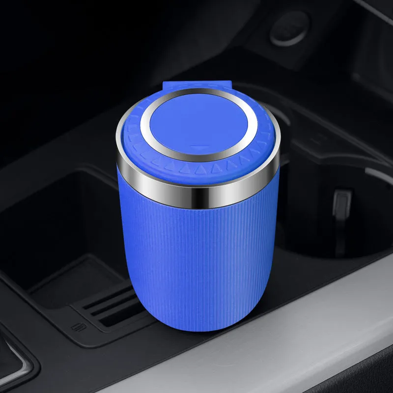 Metal ABS car ashtray with cover and blue LED light against a dark background