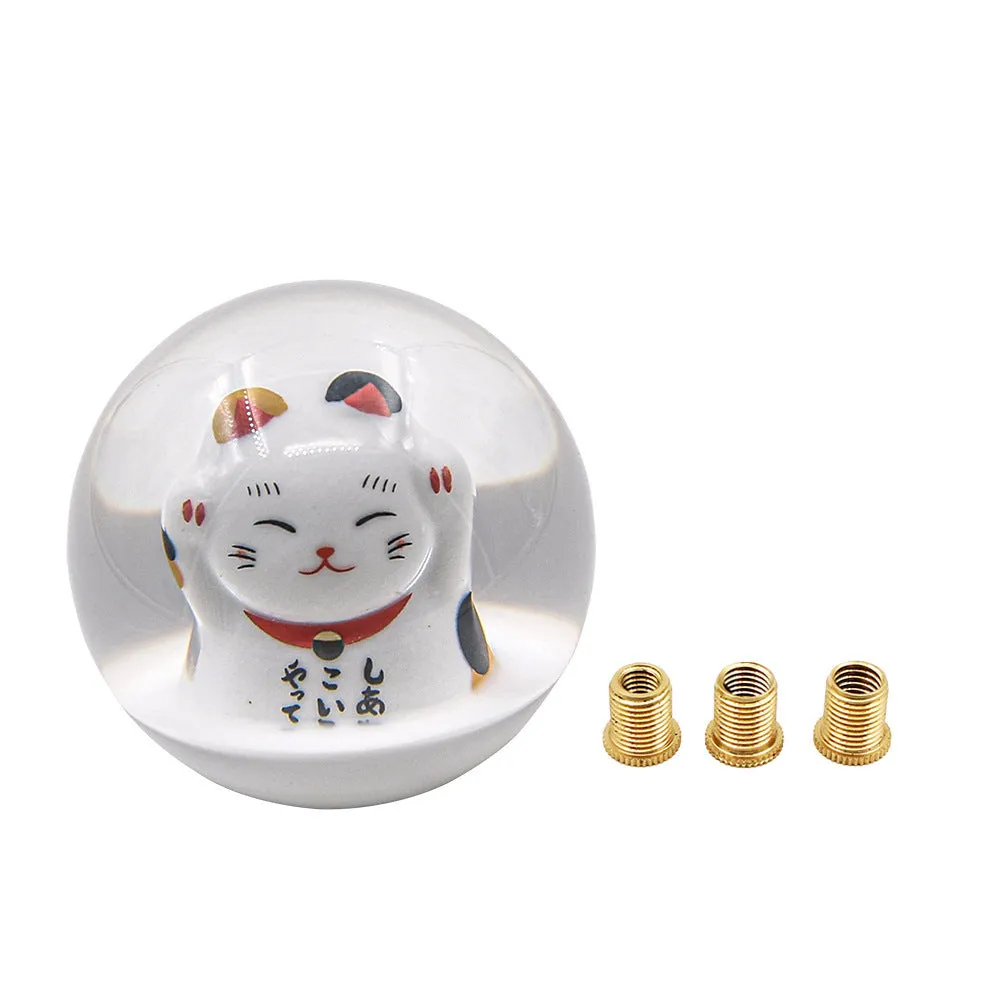 JDM Lucky Cat acrylic gear head with three metal adapters on a grey background