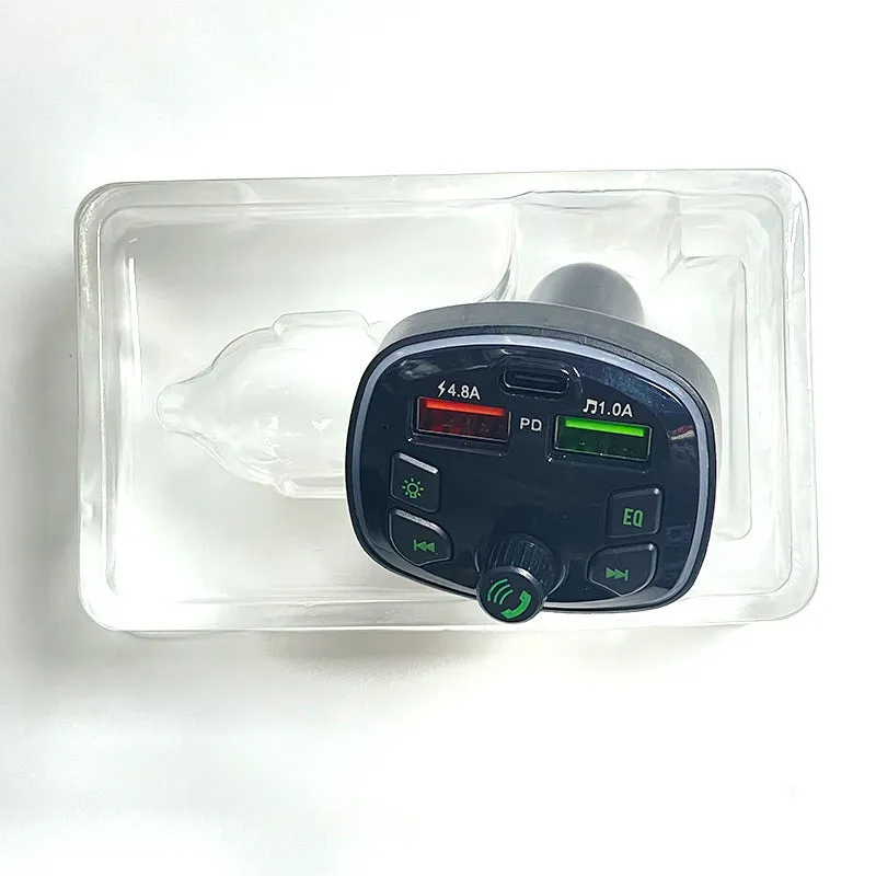 Q7 Automotive MP3 Player Bluetooth FM Transmitter connected to car cigarette lighter socket, showing 1.1-inch display.