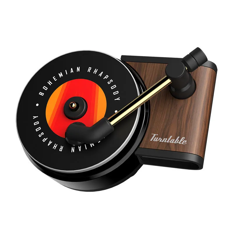 Black turntable car aroma diffuser with ocean scent fragrance tablet on car dashboard