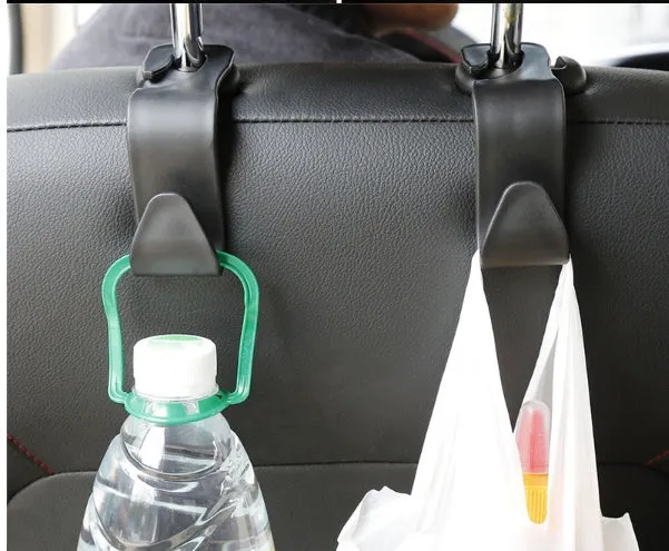 Set of 4 black PP universal car seat back hooks, each 11cm x 3.5cm, with 20kg weight capacity, for hanging bags from car front seat backs