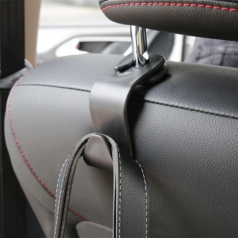 Set of 4 black PP universal car seat back hooks, each 11cm x 3.5cm, with 20kg weight capacity, for hanging bags from car front seat backs