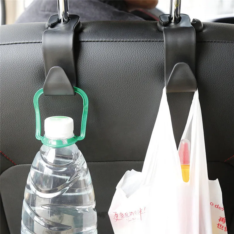 Set of 4 black PP universal car seat back hooks, each 11cm x 3.5cm, with 20kg weight capacity, for hanging bags from car front seat backs