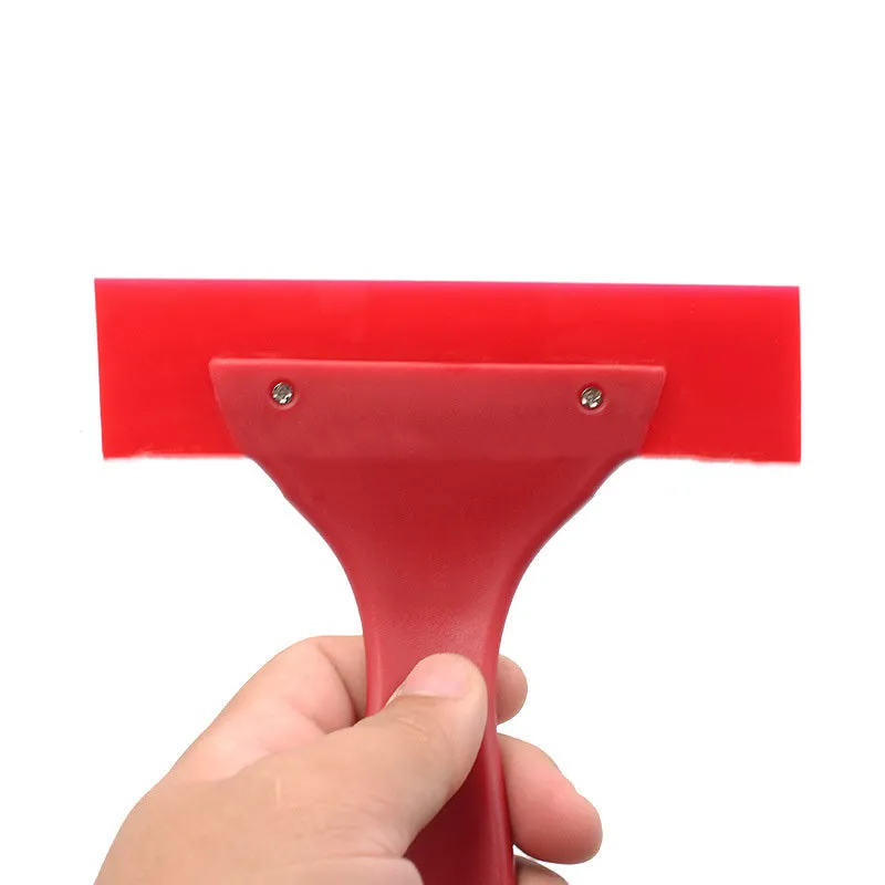 Red car film wiper tool with polyurethane head and PP handle on white background