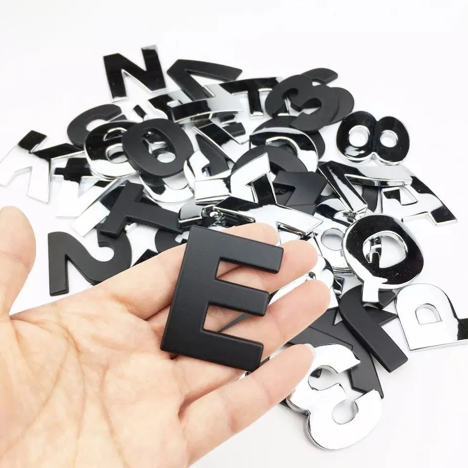 Black car tail letter label sticker measuring 4.5cm on a vehicle bumper