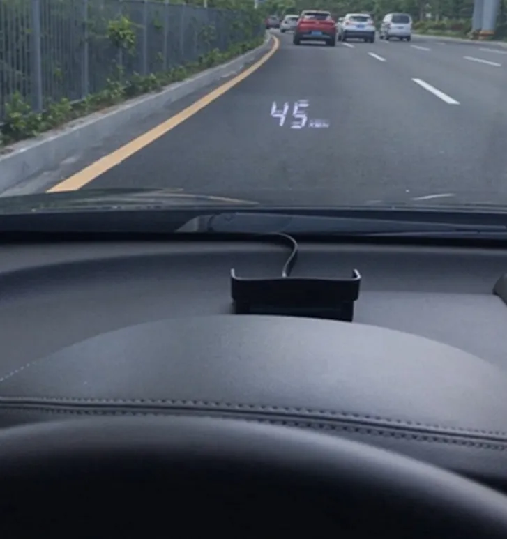 A100 OBD II head up display projecting vehicle speed on windscreen, with white or green light option