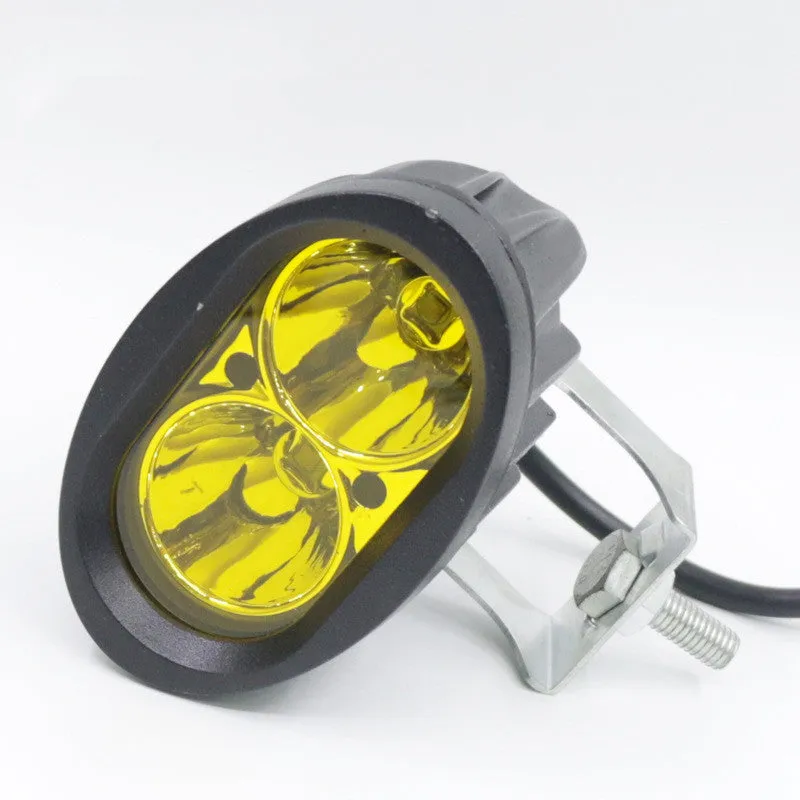 Direct selling motorcycle LED spotlight with aluminium housing in white and yellow light options on dark background
