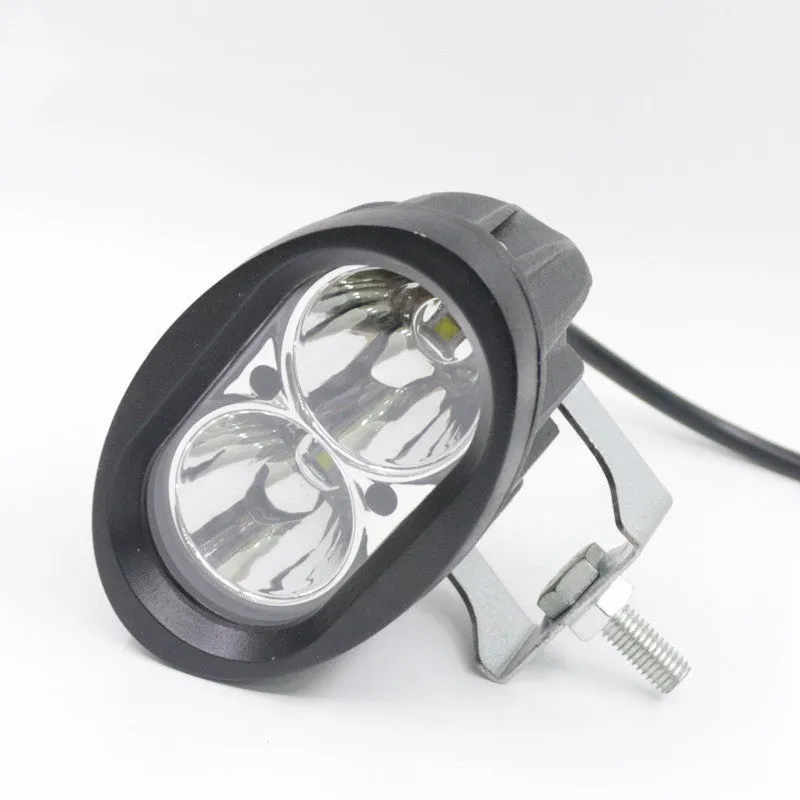 Direct selling motorcycle LED spotlight with aluminium housing in white and yellow light options on dark background