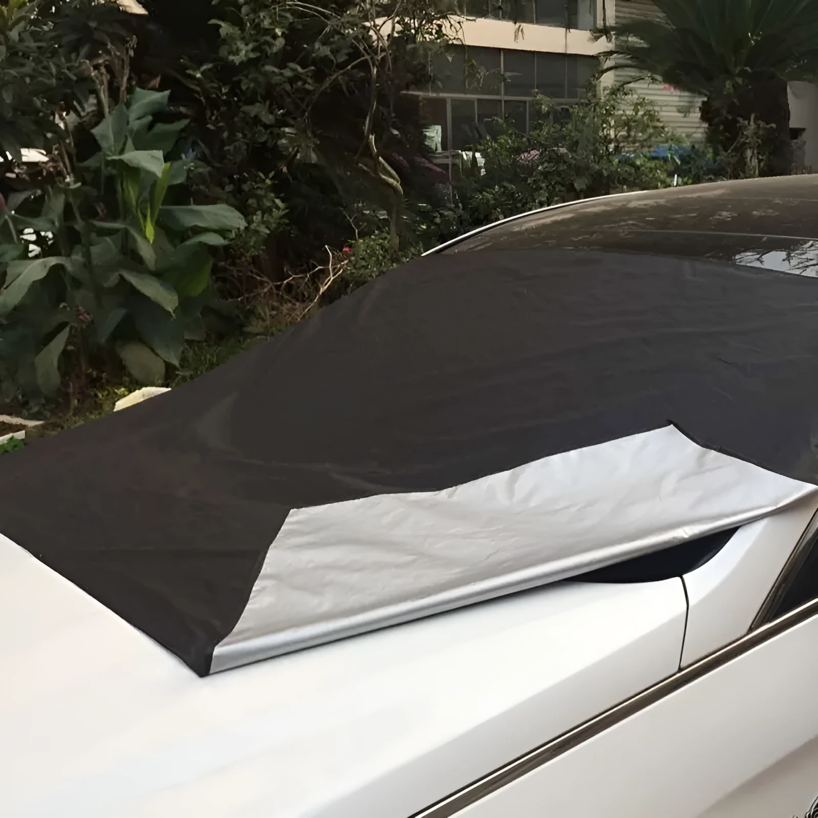 Magnetic car windscreen snow cover in black with silver back, 210x120cm size, six magnets visible