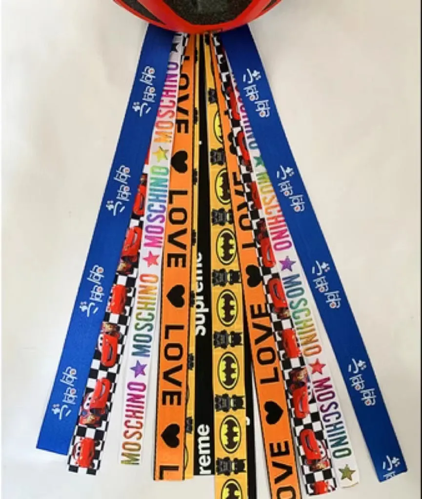 Children's helmet decorative streamer with elastic loop attachment in multiple colour options
