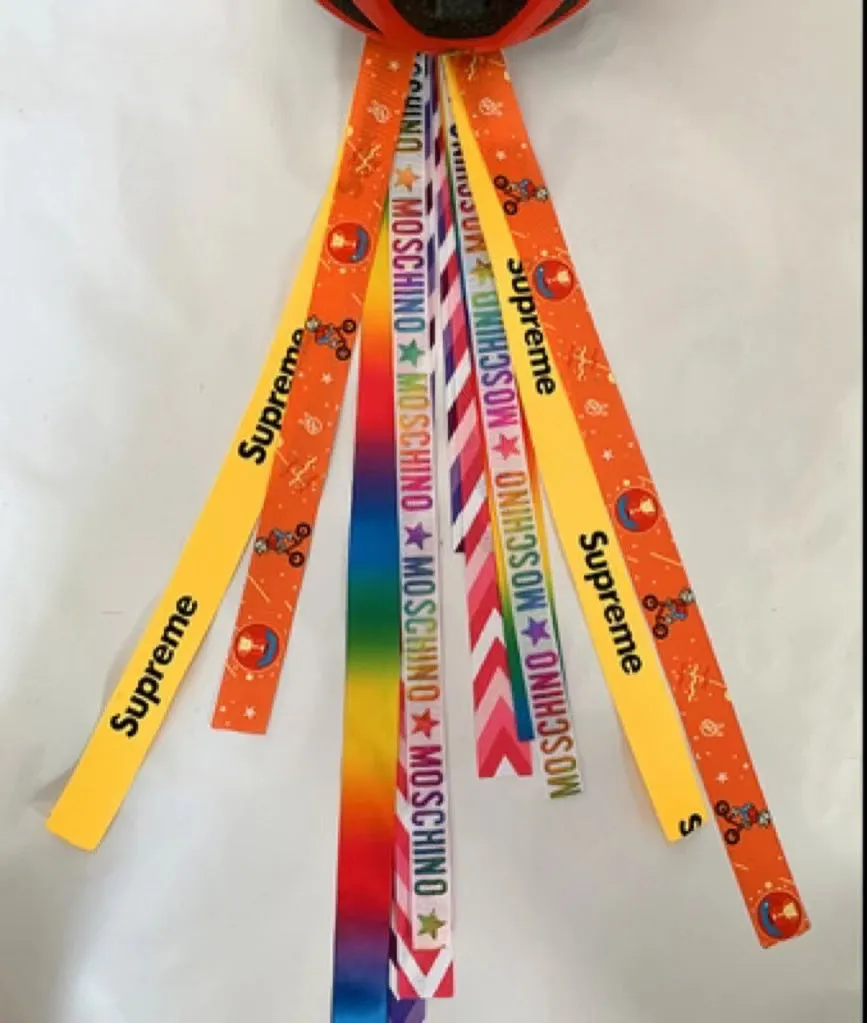 Children's helmet decorative streamer with elastic loop attachment in multiple colour options