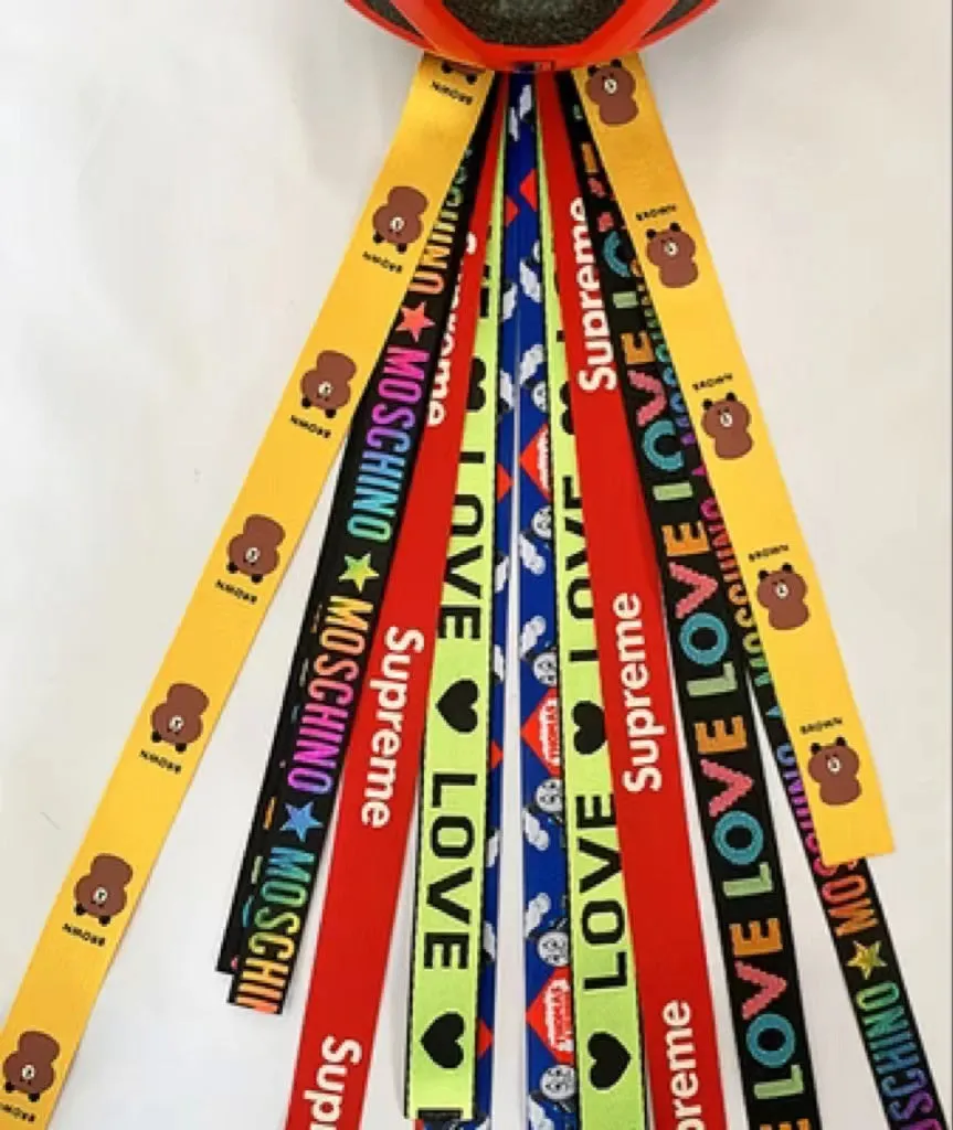 Children's helmet decorative streamer with elastic loop attachment in multiple colour options