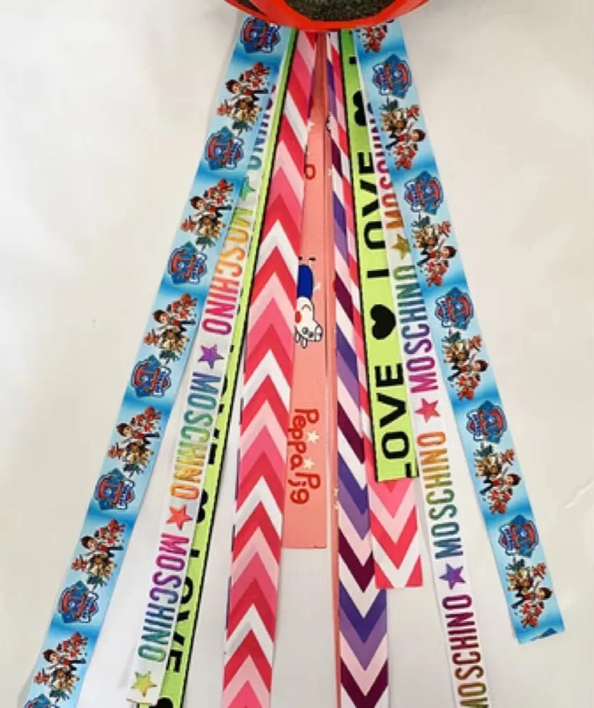 Children's helmet decorative streamer with elastic loop attachment in multiple colour options