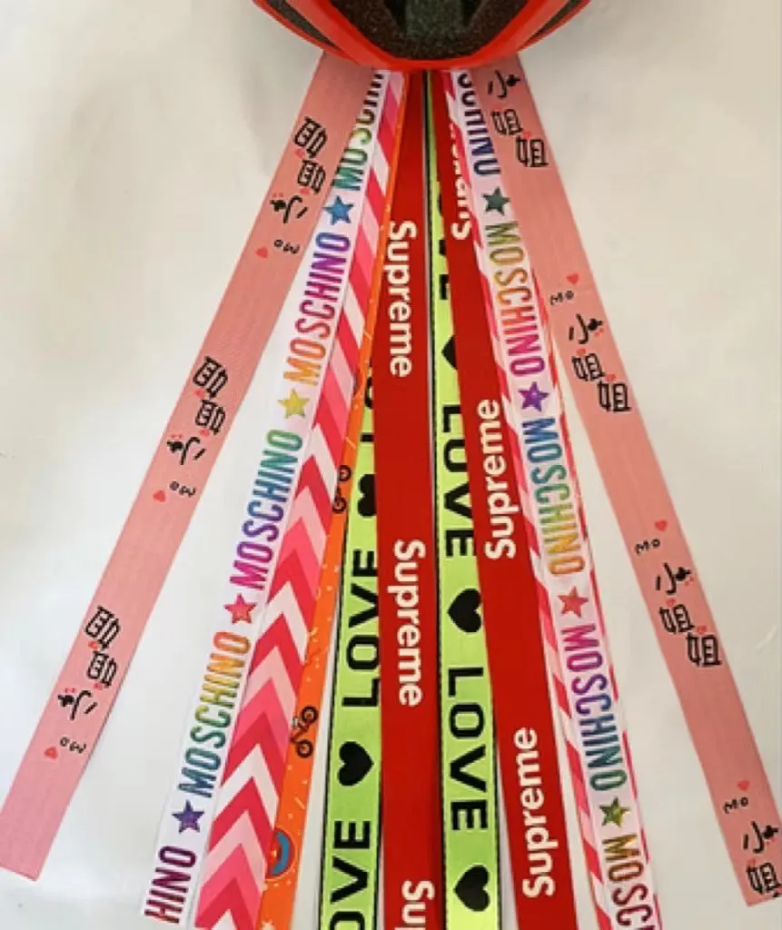 Children's helmet decorative streamer with elastic loop attachment in multiple colour options