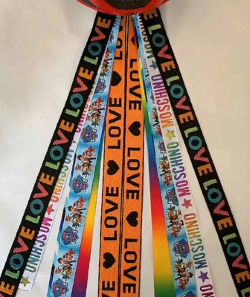 Children's helmet decorative streamer with elastic loop attachment in multiple colour options