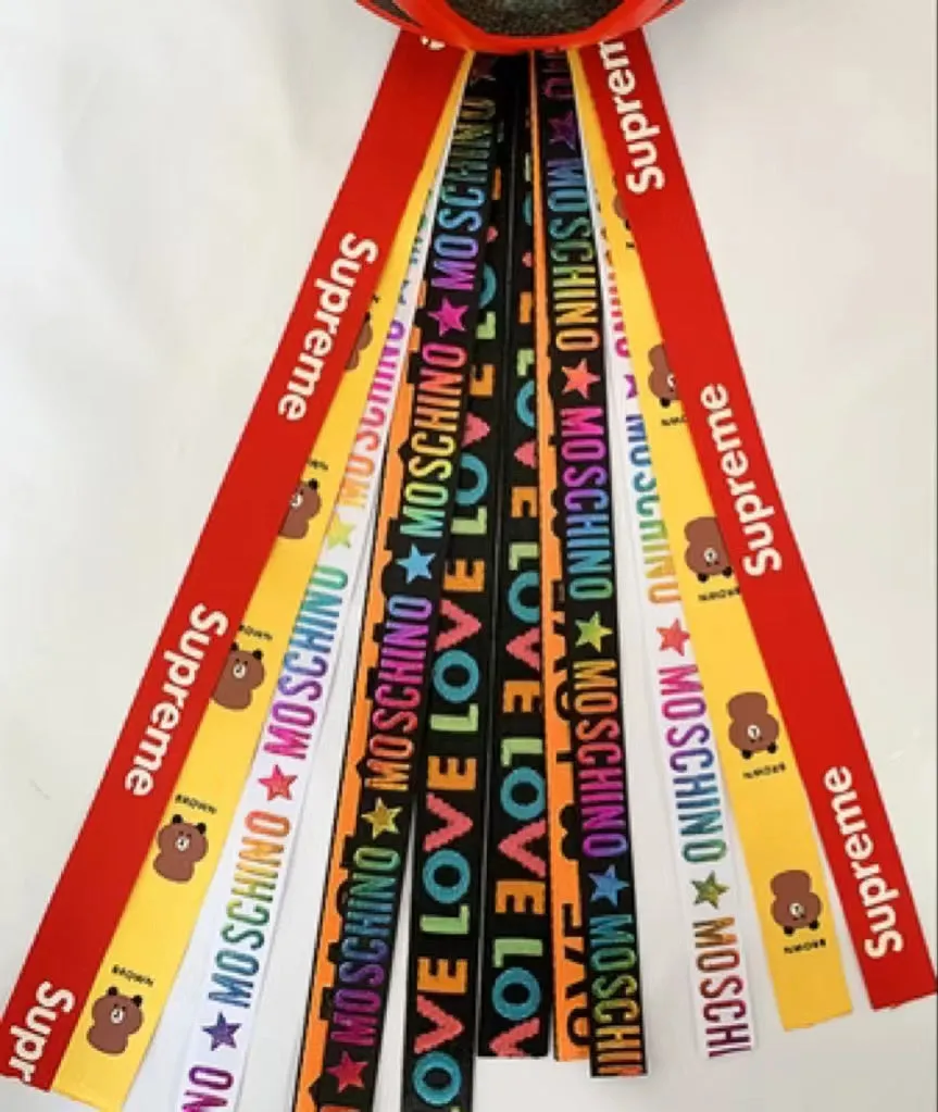 Children's helmet decorative streamer with elastic loop attachment in multiple colour options