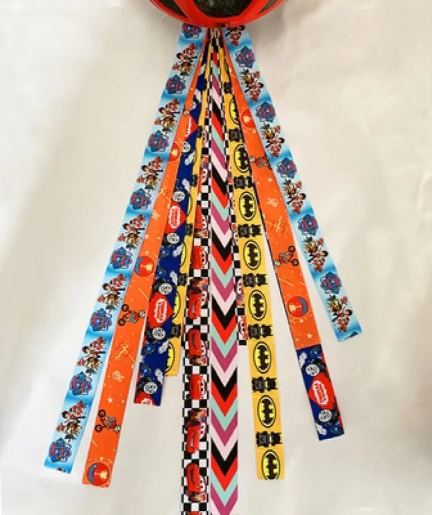 Children's helmet decorative streamer with elastic loop attachment in multiple colour options