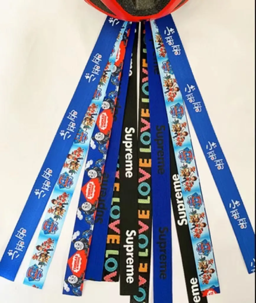 Children's helmet decorative streamer with elastic loop attachment in multiple colour options