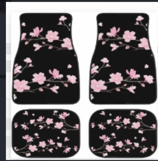 Black four-piece rubber car foot mat set with textured surface, shown on a car floor.