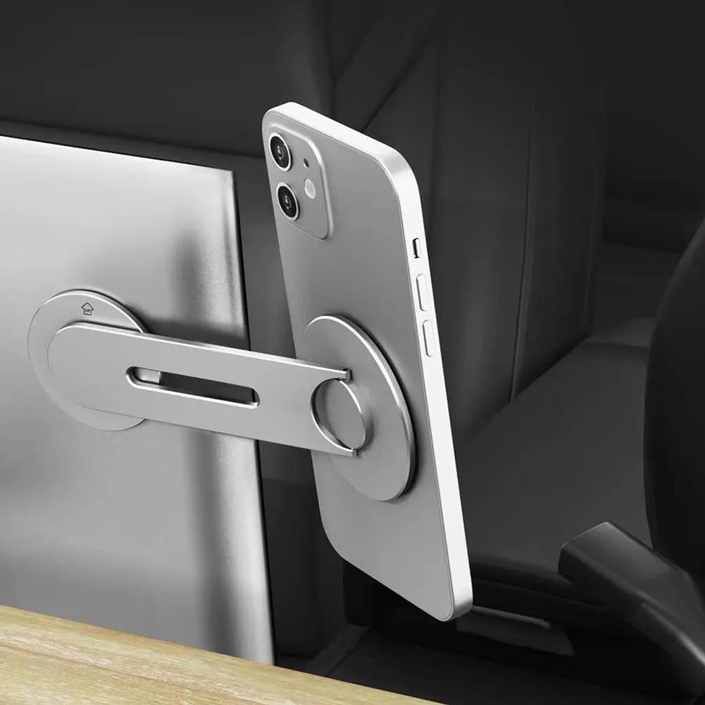 Silver aluminium alloy magnetic car phone holder mounted on Tesla suspension screen with 180° flip adjustment