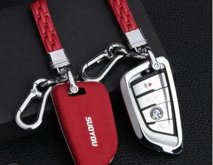 Suede key case with zinc alloy front frame in Classic Black, Charming Red, and Saddle Brown colour options