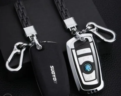 Suede key case with zinc alloy front frame in Classic Black, Charming Red, and Saddle Brown colour options