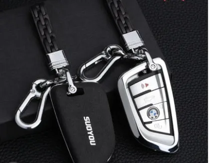 Suede key case with zinc alloy front frame in Classic Black, Charming Red, and Saddle Brown colour options