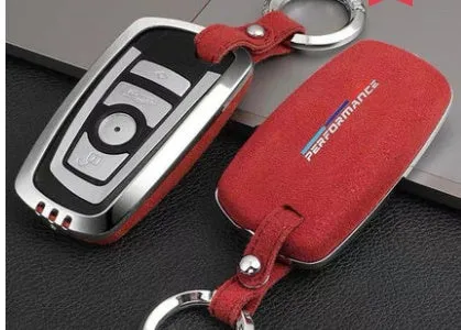 Suede key case with zinc alloy front frame in Classic Black, Charming Red, and Saddle Brown colour options