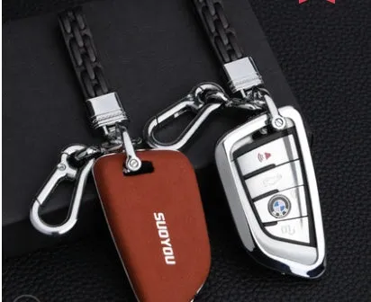 Suede key case with zinc alloy front frame in Classic Black, Charming Red, and Saddle Brown colour options