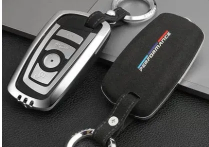 Suede key case with zinc alloy front frame in Classic Black, Charming Red, and Saddle Brown colour options