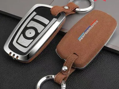 Suede key case with zinc alloy front frame in Classic Black, Charming Red, and Saddle Brown colour options