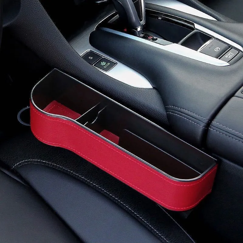 PU leather car seat gap storage box in black holding a smartphone and wallet between the console and seat