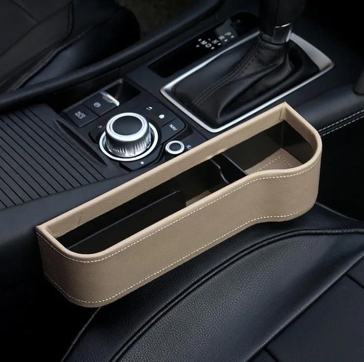 PU leather car seat gap storage box in black holding a smartphone and wallet between the console and seat