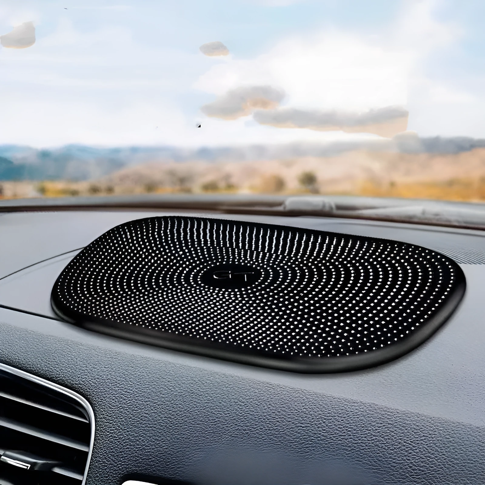 Black PU nano non-slip mat for car dashboard holding a mobile phone securely