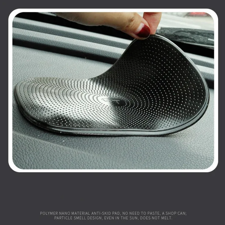Black PU nano non-slip mat for car dashboard holding a mobile phone securely
