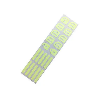 Car window luminous key sticker in blue, green, and orange colours on a window button interior