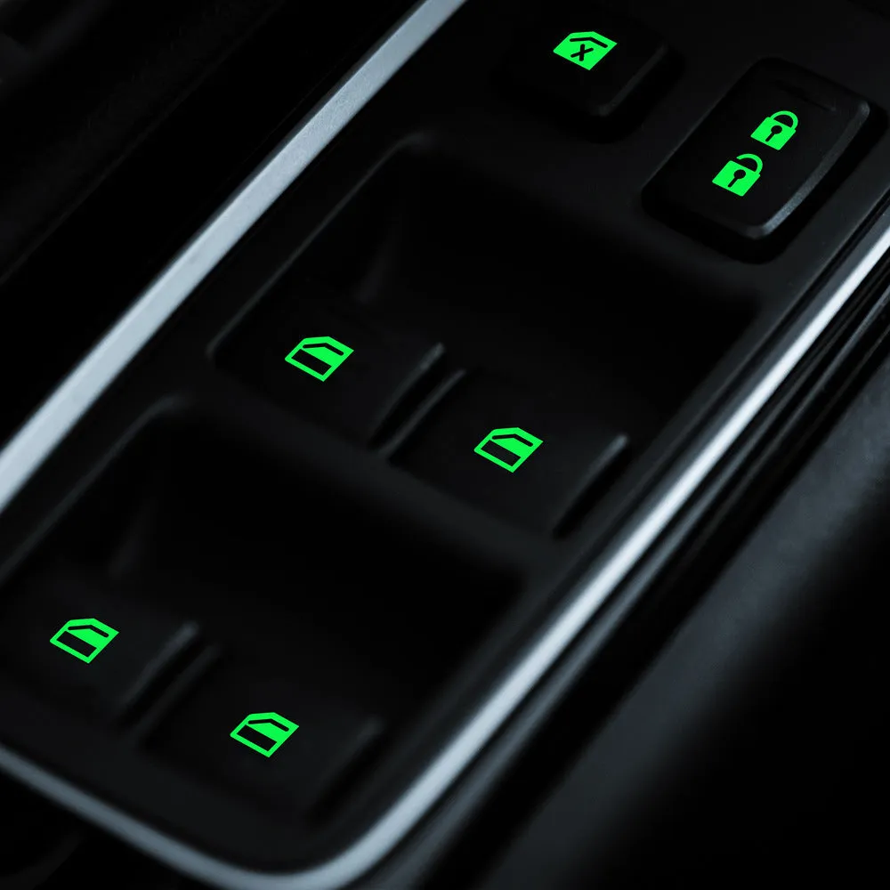 Car window luminous key sticker in blue, green, and orange colours on a window button interior