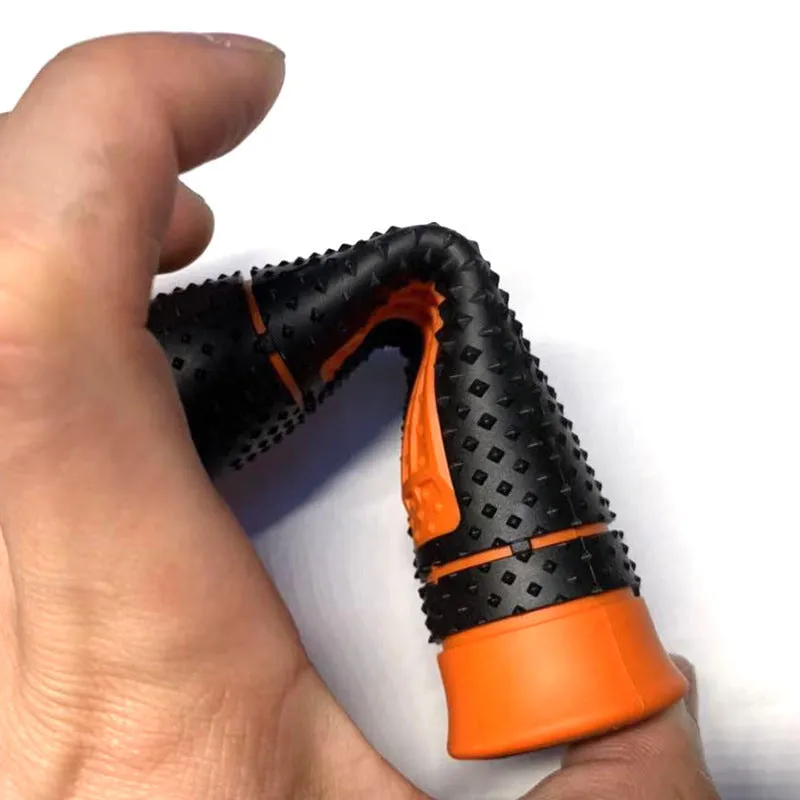 Pair of black and orange rubber motorcycle handle covers for KTM off-road bikes, shown on handlebars