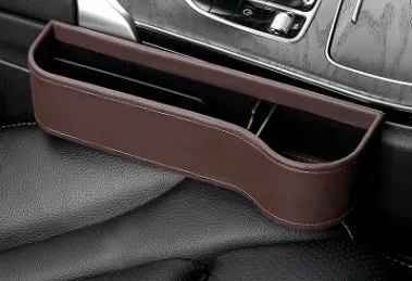 PU leather car seat gap storage box in black, showing phone and cup storage between seat and console