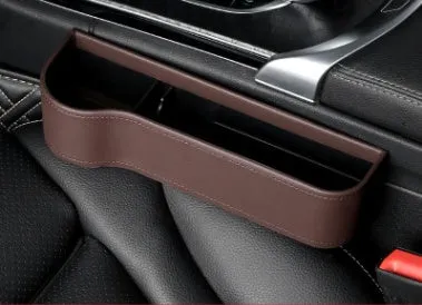 PU leather car seat gap storage box in black, showing phone and cup storage between seat and console