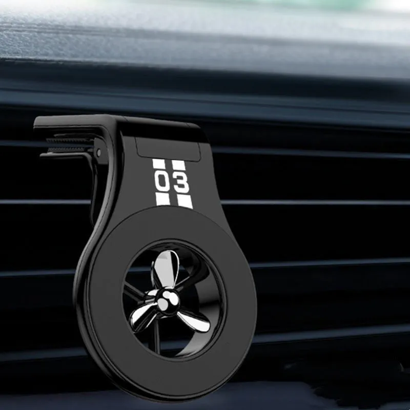Magnetic car air vent phone holder with perfume diffuser in black, showing 360-degree rotation