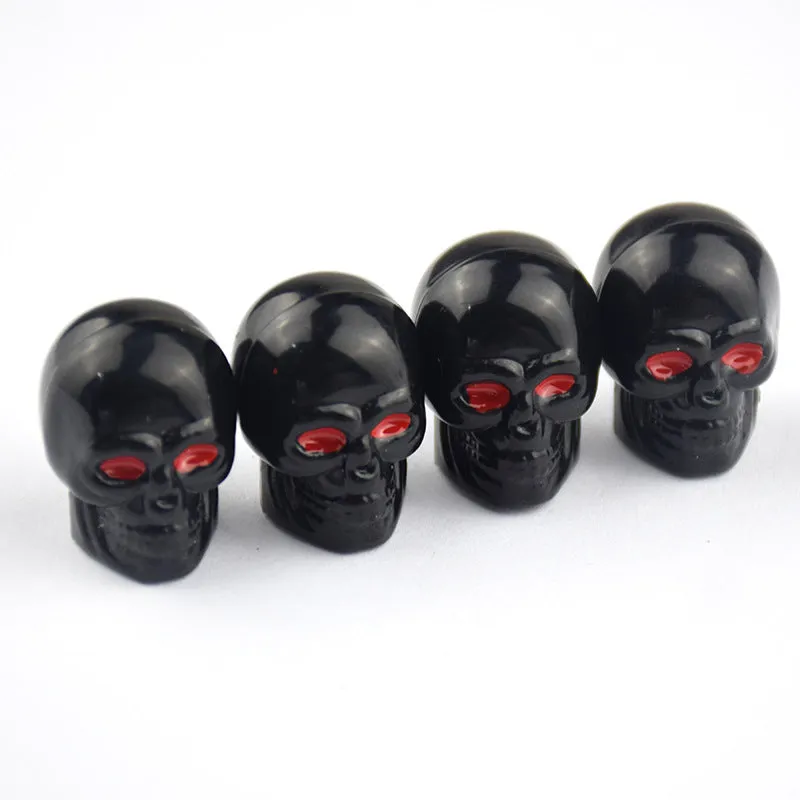 Black rubber tubeless car valve cover on a tyre valve stem