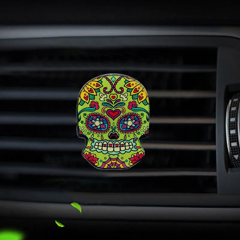 Skull-shaped acrylic car air freshener vent clip with mixed fragrance, 3.5-4.5 cm, colour option shown.