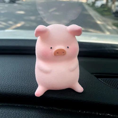 Small resin cartoon pig figurine car dashboard ornament measuring 6cm.